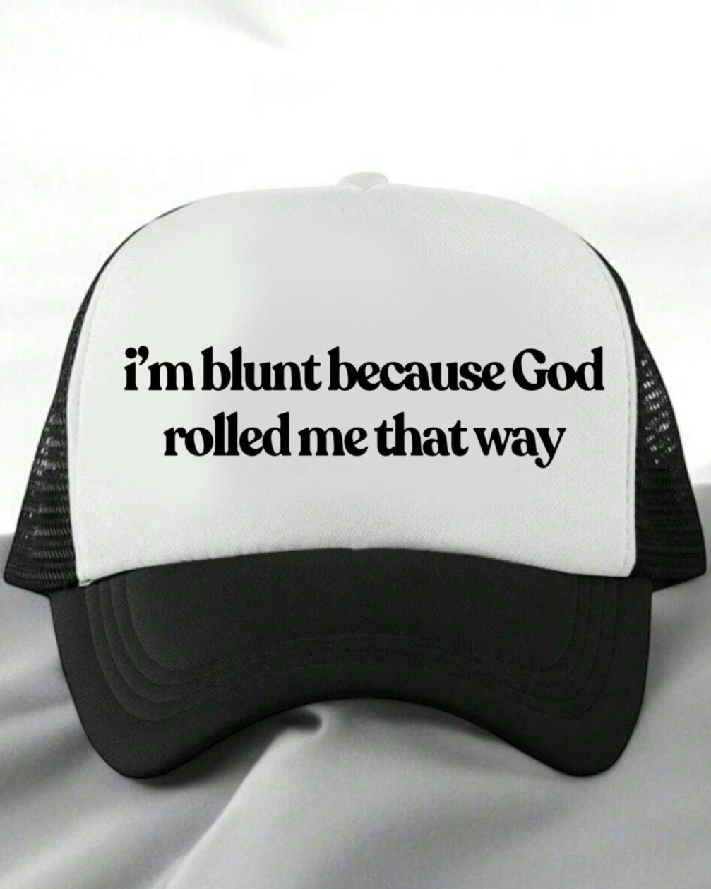 Black and white trucker hat with text on a white background