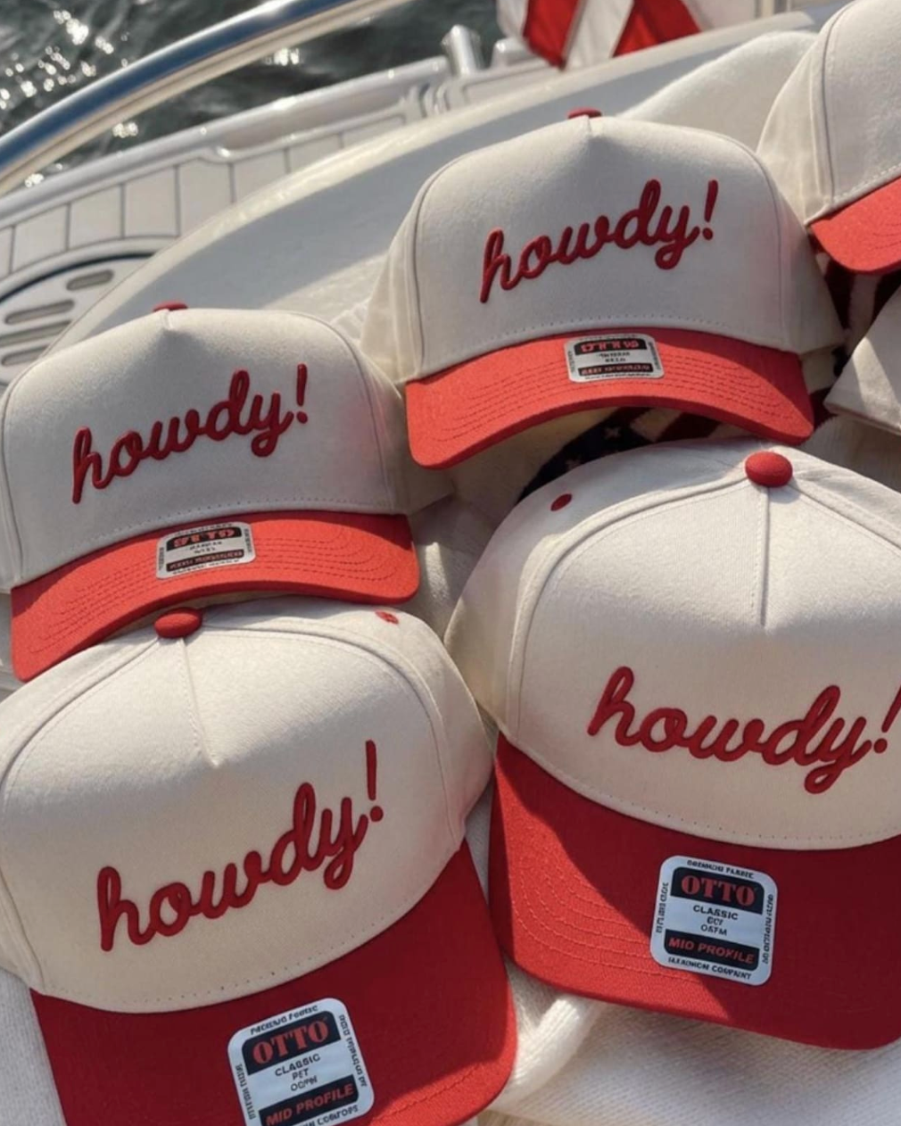 Collection of 'howdy!' hats on a boat