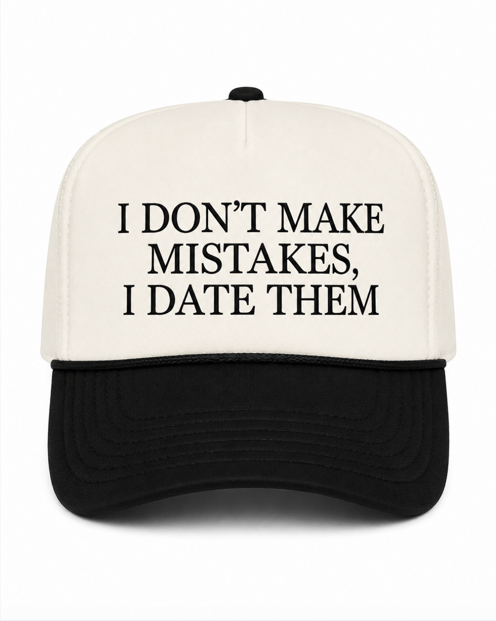 A black and white trucker-style cap with the text 'I DON'T MAKE MISTAKES, I DATE THEM' printed in black on the white front panel, shown against a plain white background.